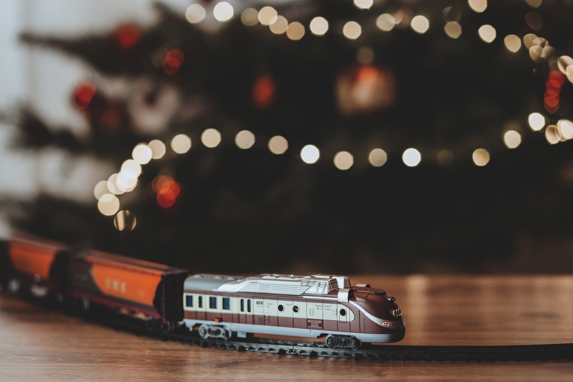 shallow focus photography on gray train plastic toy